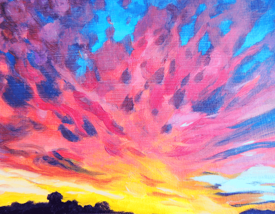 Sunset sky streaked with vivid pink and blue cloud above a dark treeline.